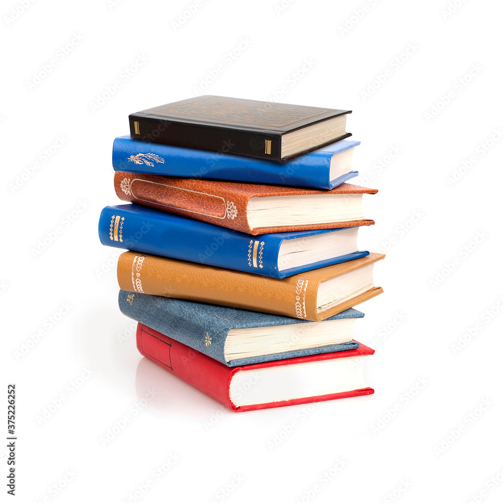 Stack of books in colour covers with white sheets isolated on a white background Stack of books in colour covers with white sheets isolated on a white background