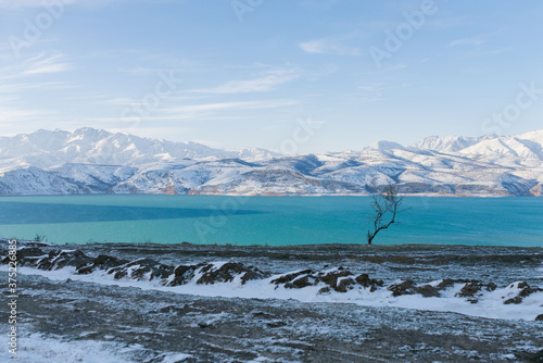 Charvak reservoir in winter in Uzbekistan. Beautiful winter landscape, postcard photo