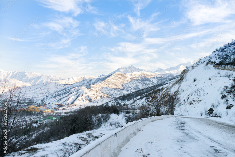 Snowy mountain road near the Charvak Reservoir in the Tashkent region