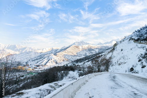 Snowy mountain road near the Charvak Reservoir in the Tashkent region