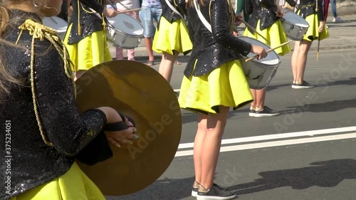 Young girls drummer at the parade. Street performance