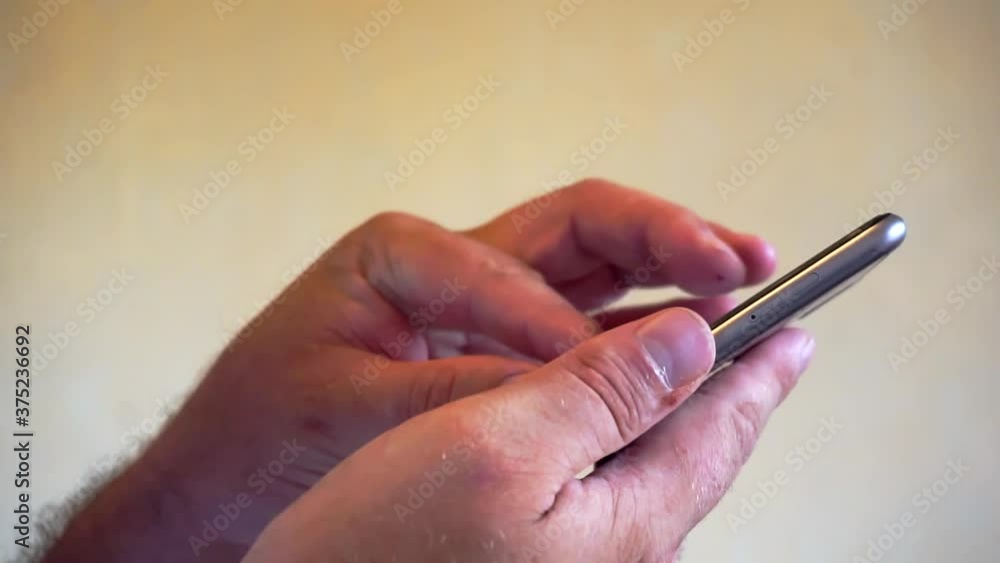 Close up of a man using mobile smart phone Close up of a man using mobile smart phone