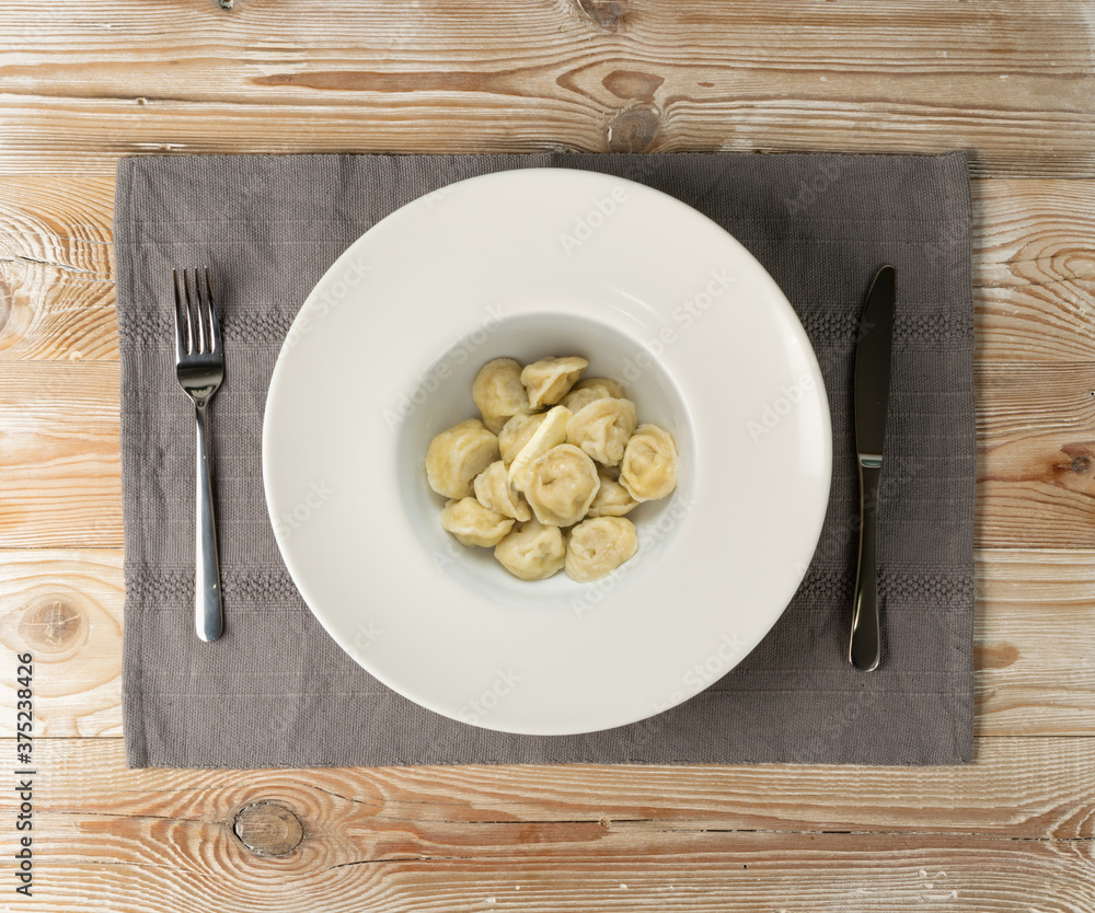 Homemade Meat Dumplings or Russian Pelmeni with Butter Homemade Meat Dumplings or Russian Pelmeni with Butter