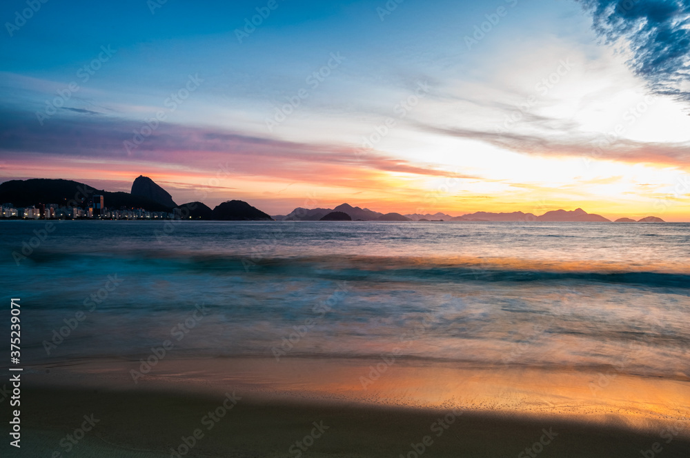 Sunrise at Copacabana beach in Rio de Janeiro.