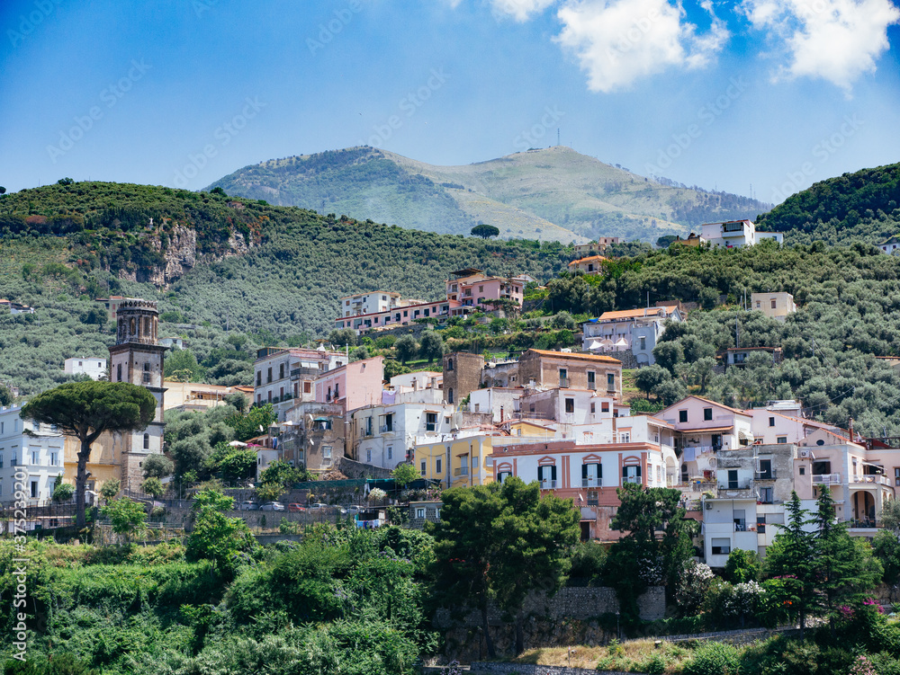 Village with building on mountainside in south Italy during summer