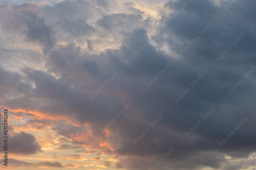 Fototapeta premium Abstract background of cloudy sunset sky golden hour.
