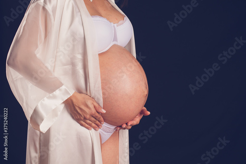 Pregnant woman Holding belly 