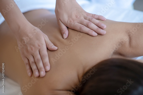 Close up picture of hands doing back massage