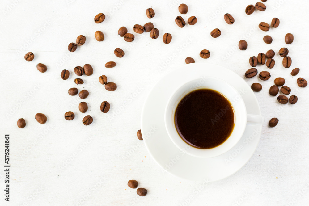 Coffee espresso in the cup on the white background and coffee beans, black coffee Coffee espresso in the cup on the white background and coffee beans, black coffee