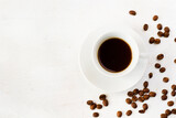 Coffee espresso in the cup on the white background and coffee beans, black coffee