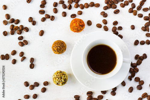 Coffee espresso and truffles balls on the plate