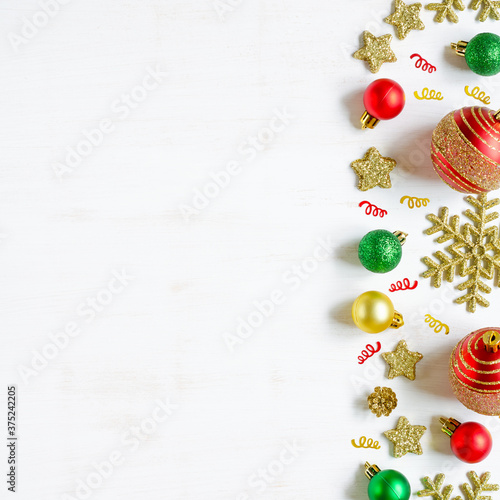 Festive Christmas accessories on white wooden background