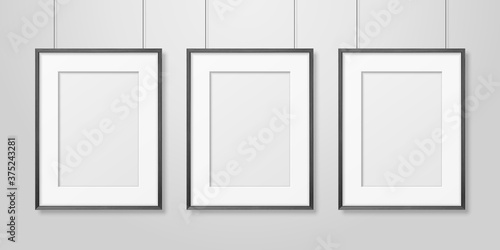 Vector 3d Realistic Three A4 Black Wooden Simple Modern Frame on a White Wall Background. It can be used for presentations. Design Template for Mockup, Front View