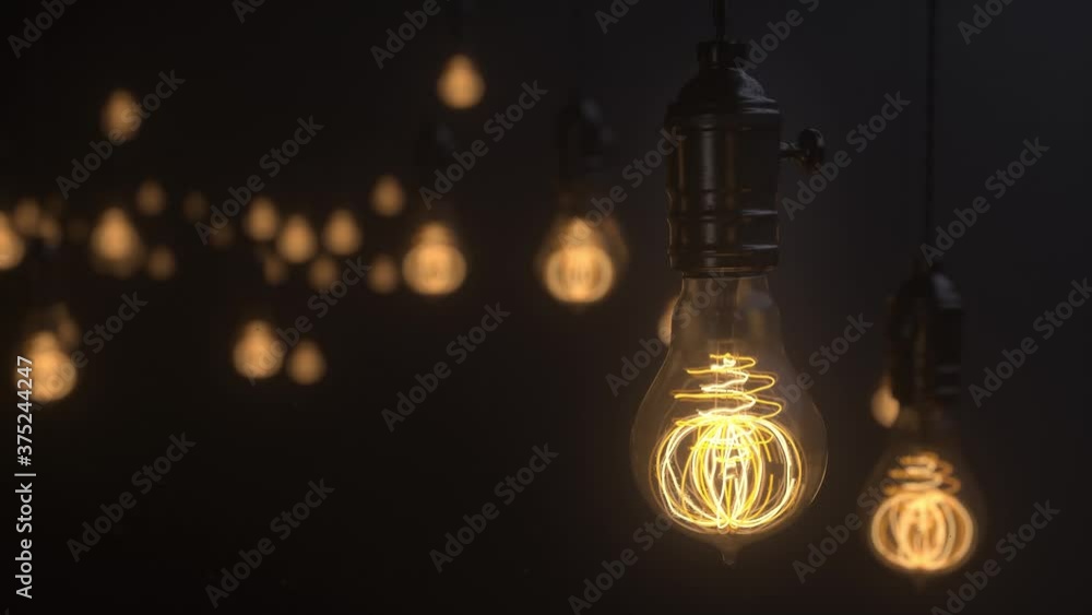 Edison lamps. Vintage light bulb pulsing light in the darkness. Burning