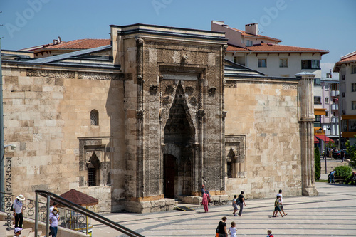 Sivas / Turkey - August 3, 2020: Sivas Buruciye Madrasah Seljuk era was built in 1271. The portal of the madrasa. The stone workmanship in the portal carries traces of Seljuk art. photo