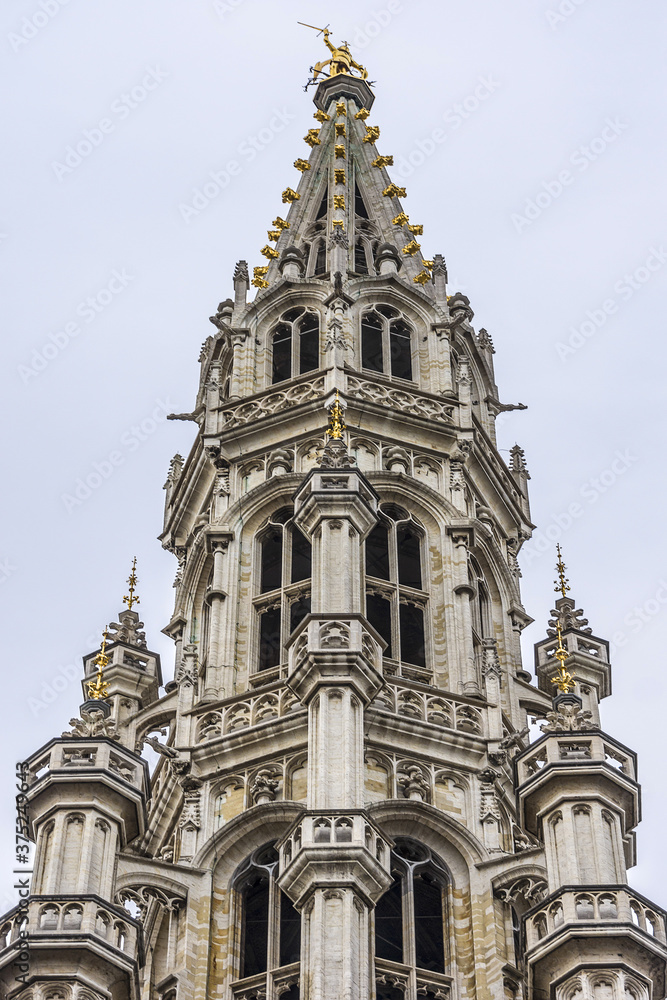 Architectural fragment of Town Hall (Hotel de Ville) on Grand Place (Grote Markt), Brussels central square - most important tourist destination and most memorable landmark in Brussels, Belgium. 