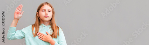 Photography Optimistic, honest and cute girl give oath, swear tell truth, put hand on heart