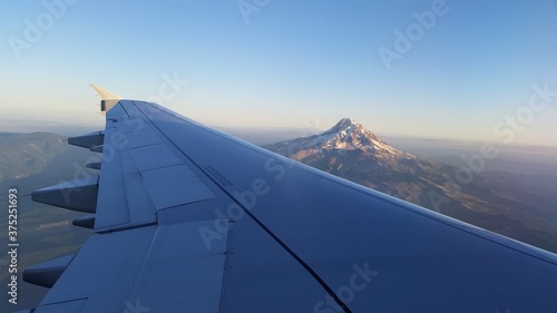 Airplane Wing Over Mountain Range