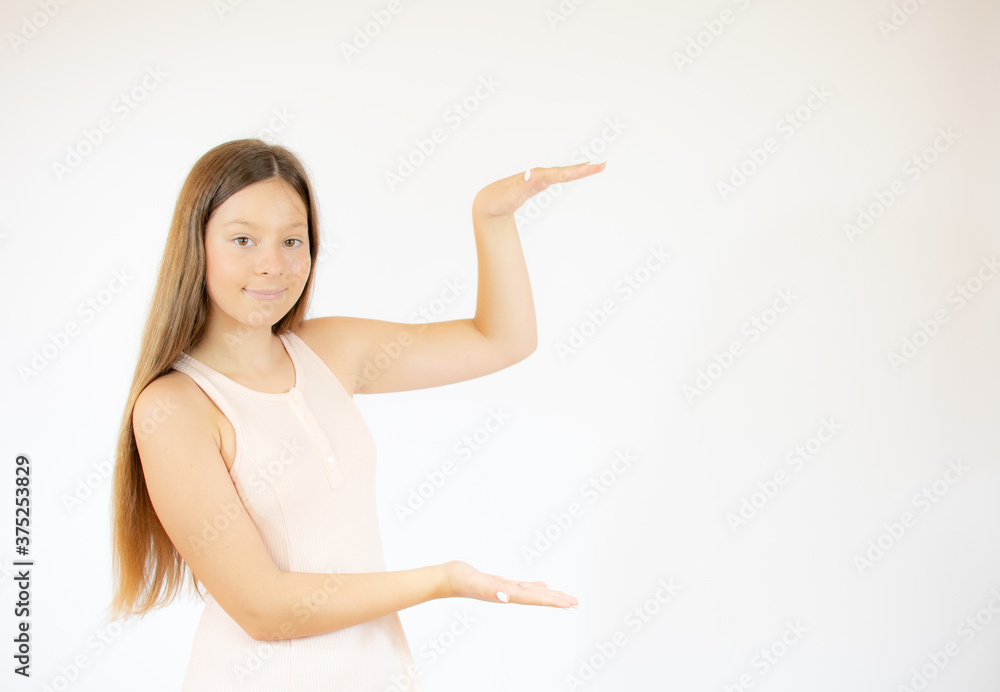 Smiling beautiful girl with long hair pointing something Smiling beautiful girl with long hair pointing something