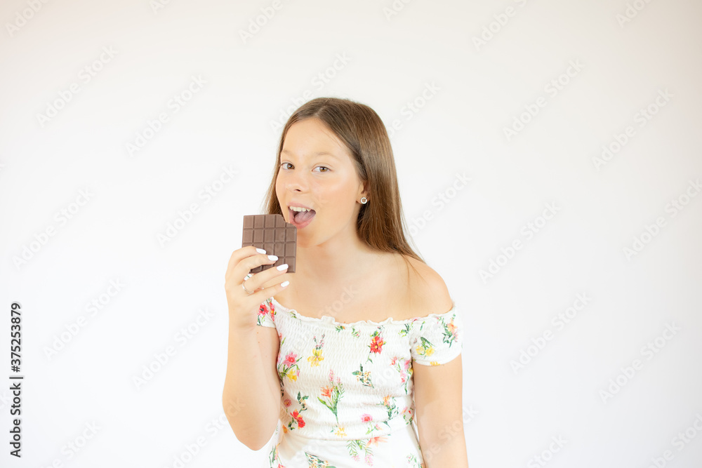 Girl with long hair with a piece of chocolate Girl with long hair with a piece of chocolate