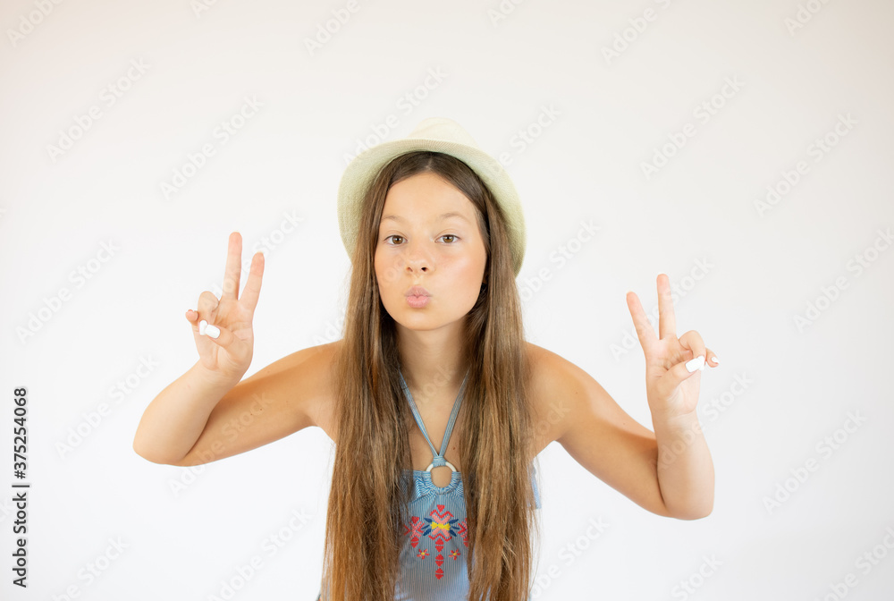Girl with long hair making the victory gesture Girl with long hair making the victory gesture