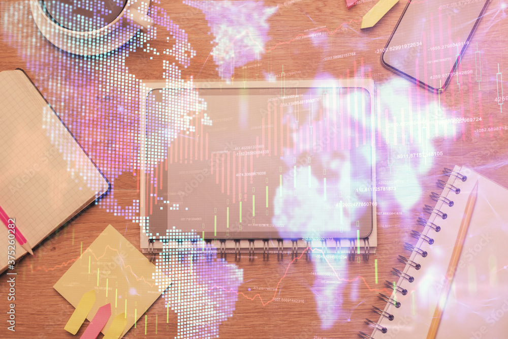 Double exposure of forex chart hologram over desktop with phone. Top view. Mobile trade platform concept. Double exposure of forex chart hologram over desktop with phone. Top view. Mobile trade platform concept.