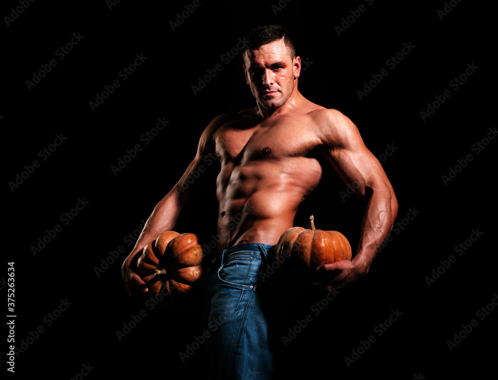 Halloween banner. Trick or treat. Sexy Halloween man holding pumpkin