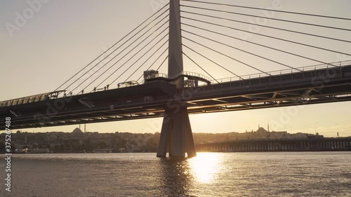 The metro leaves at sunset from the station on the bridge over the Golden Horn