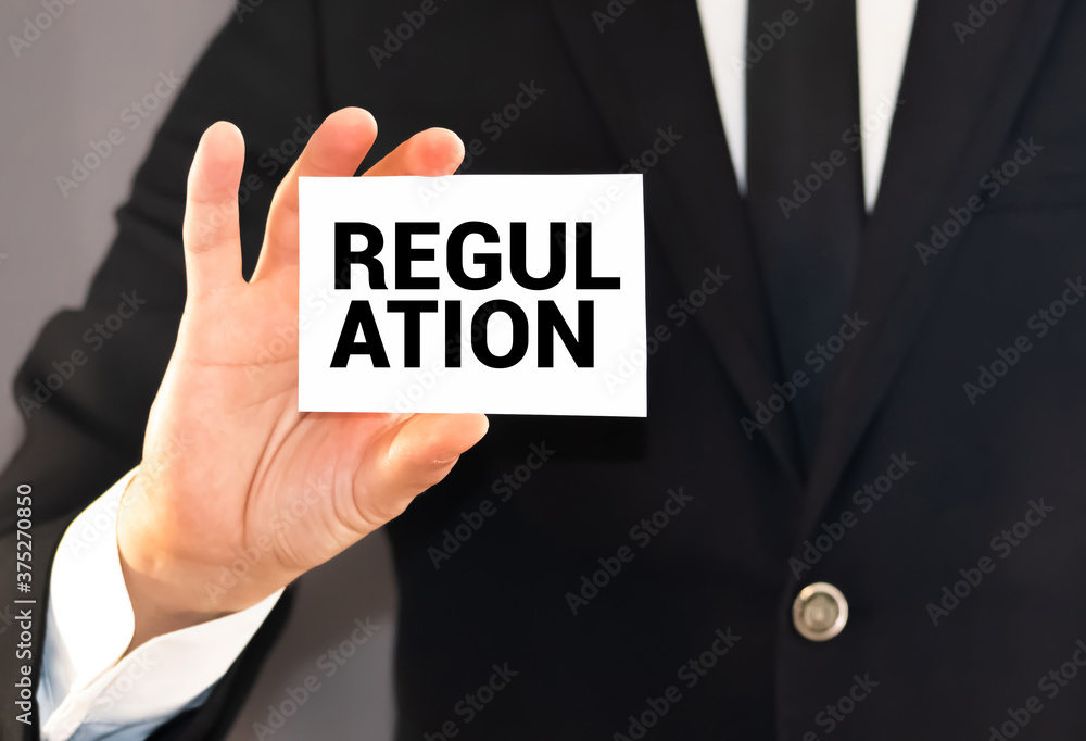 Rules and regulation memo written on a notebook with pen Rules and regulation memo written on a notebook with pen