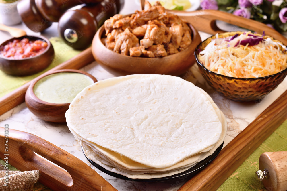 Fototapeta premium Traditional Mexican food, burritos with meat and cheese