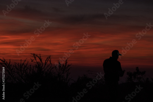 man silhouette at sunset
