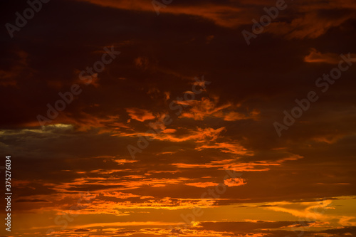 Beautiful sunset sky and clouds. Dramatic orange, red sky. 