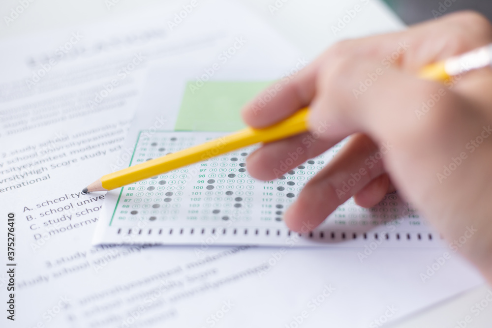 high school,university student study.hands holding pencil writing paper answer sheet.sitting lecture chair taking final exam attending in examination classroom.concept scholarship for education abroad high school,university student study.hands holding pencil writing paper answer sheet.sitting lecture chair taking final exam attending in examination classroom.concept scholarship for education abroad