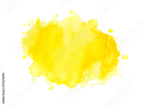 yellow watercolor splashes of paint on paper background. © caanebez