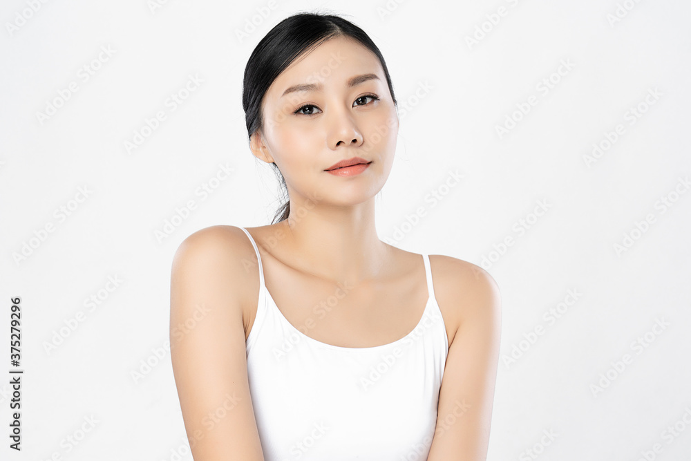 Beautiful Young asian Woman with Clean Fresh Skin, on white background, Face care, Facial treatment, Cosmetology, beauty and spa, Asian women portrait Beautiful Young asian Woman with Clean Fresh Skin, on white background, Face care, Facial treatment, Cosmetology, beauty and spa, Asian women portrait