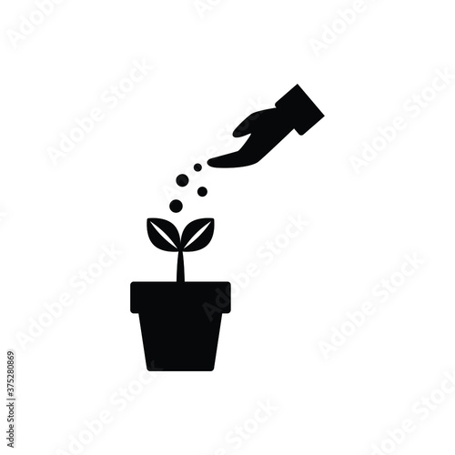 Plant fertilizing icon vector on white background, sign and symbol.
