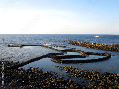 The Twin Hearts Stone Weir (七美雙心石滬) in Qimei (sometimes spelled Cimei) Island, Penghu County, TAIWAN photo