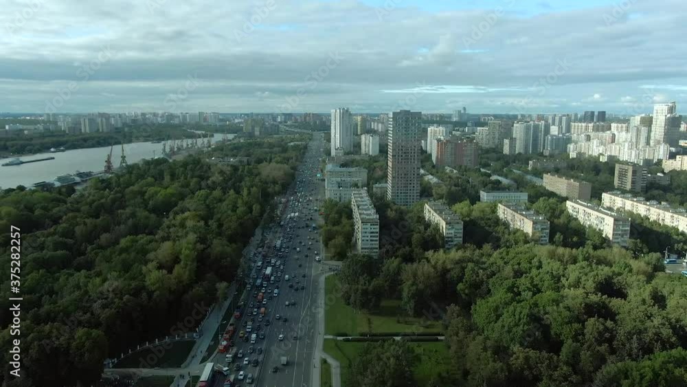 Aerial view flight over the central avenue in Moscow at sunset. Car traffic on the highway in the city. cityscape from drone Aerial view flight over the central avenue in Moscow at sunset. Car traffic on the highway in the city. cityscape from drone