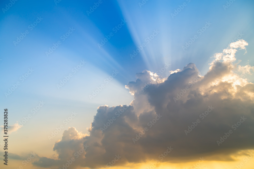 Sky with light ray and clouds at sunset, nature background.
