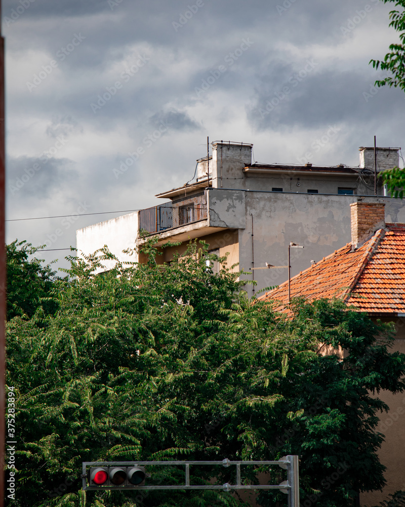 dark cloud over brutalist building in Sombor, Serbia