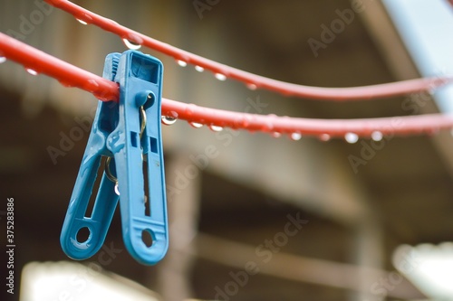 close up plastic clothes peg on wire