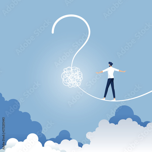 Metaphor for confusion as a business and finding solutions, Businessman walking on a tight rope shaped as a question mark, Risk uncertainty and planning a new journey