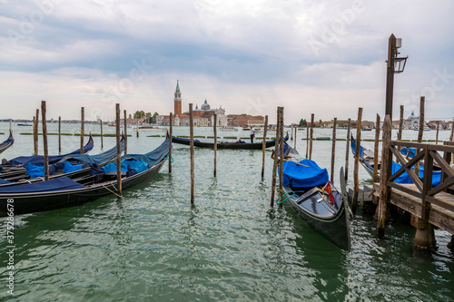 Jetty with gondolas on the Venice promenade © i_valentin