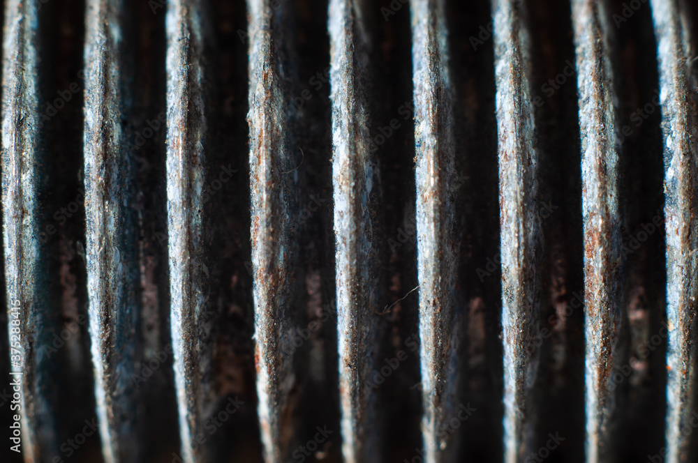 Bolt thread close-up, macro shot. Symmetrical lines texture Bolt thread close-up, macro shot. Symmetrical lines texture