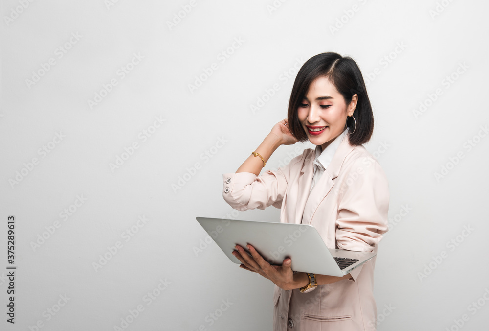Working woman is working on her labtop with backgroud white Working woman is working on her labtop with backgroud white