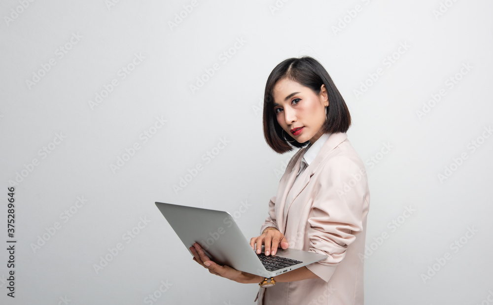 Working woman is working on her labtop with backgroud white Working woman is working on her labtop with backgroud white