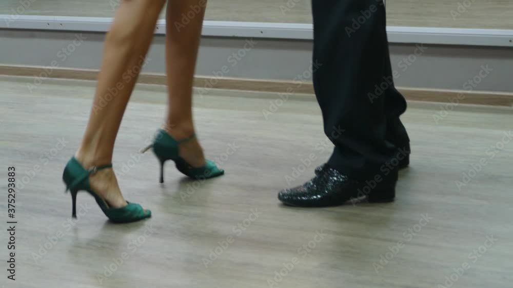Argentine tango. Legs of a couple dancing an Argentine tango. Close up. City Of Novosibirsk, Siberia. Argentine tango. Legs of a couple dancing an Argentine tango. Close up. City Of Novosibirsk, Siberia.