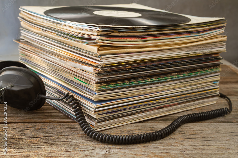 Fototapeta premium Headphones and favorite old vinyl records.