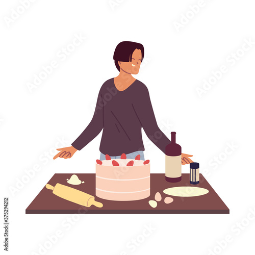 young man cook preparing a cake