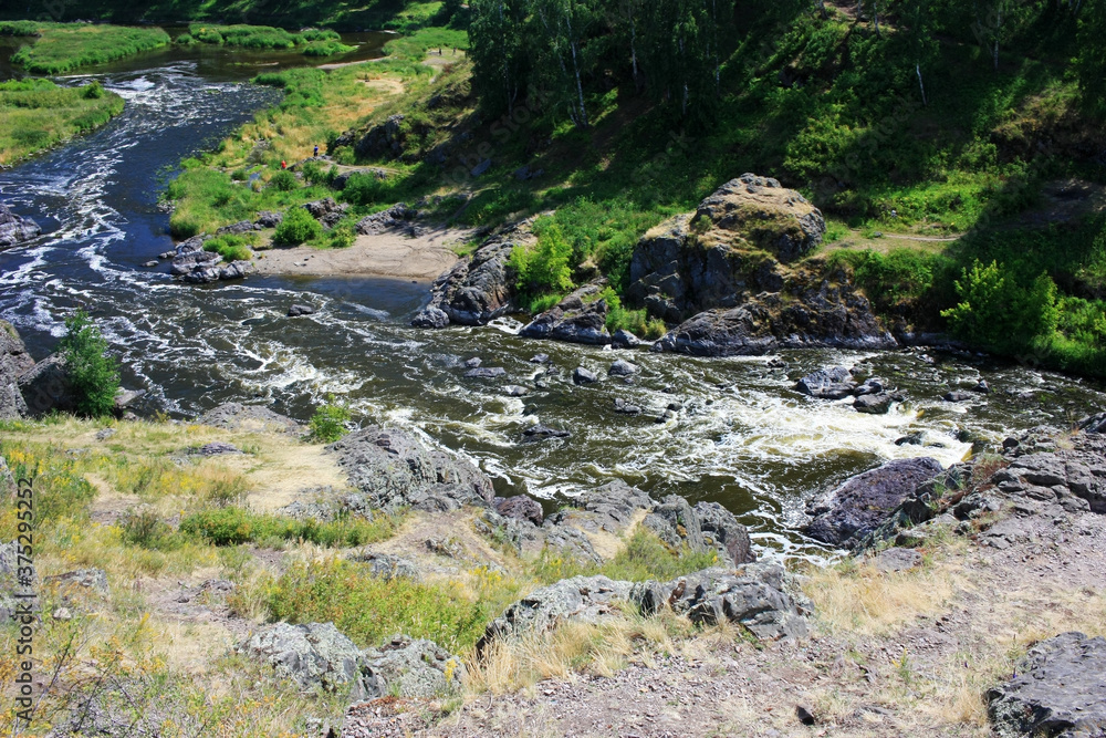 Large boulders in a mountain river Large boulders in a mountain river